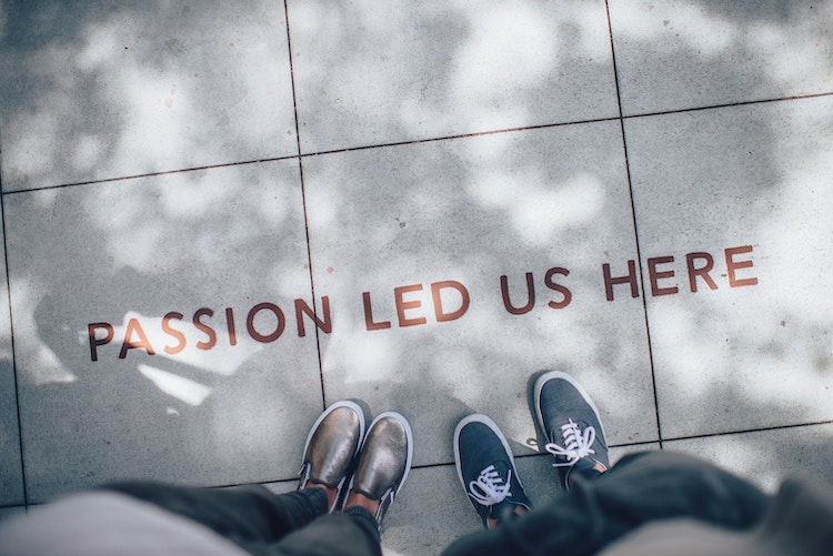 A lettering on the ground that reads 'Passion led us here'